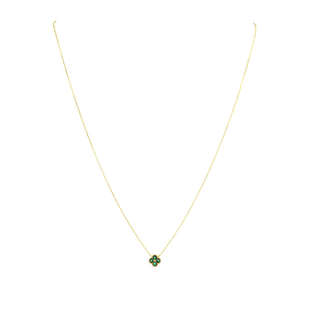 Gold necklace with a green pendant on a white background