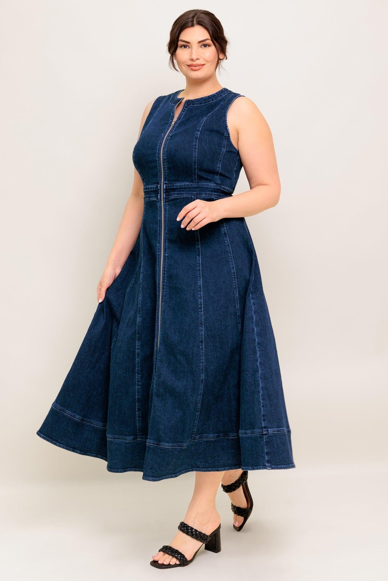 Woman wearing a blue denim dress on a white background