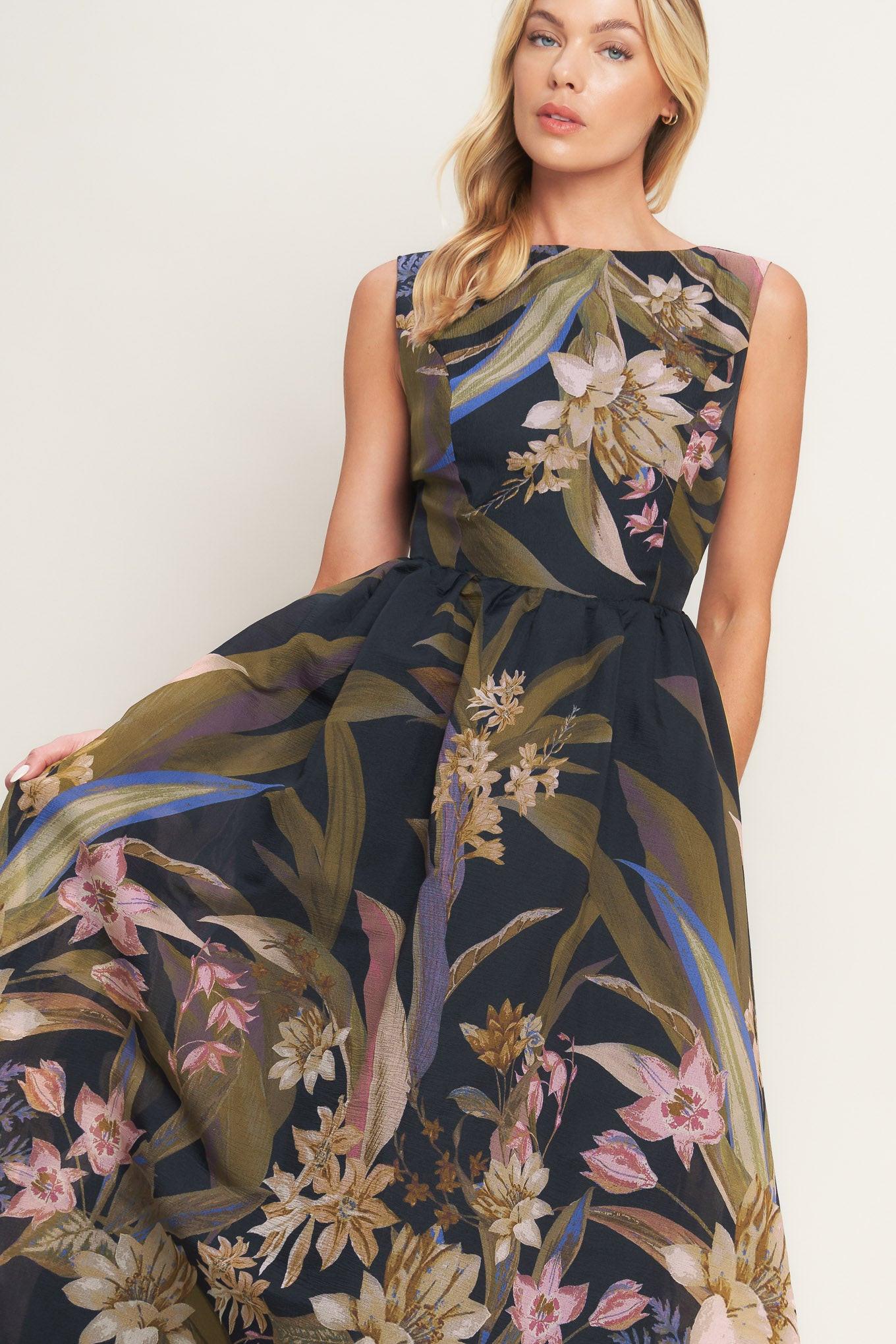 Woman wearing a floral dress with a white background