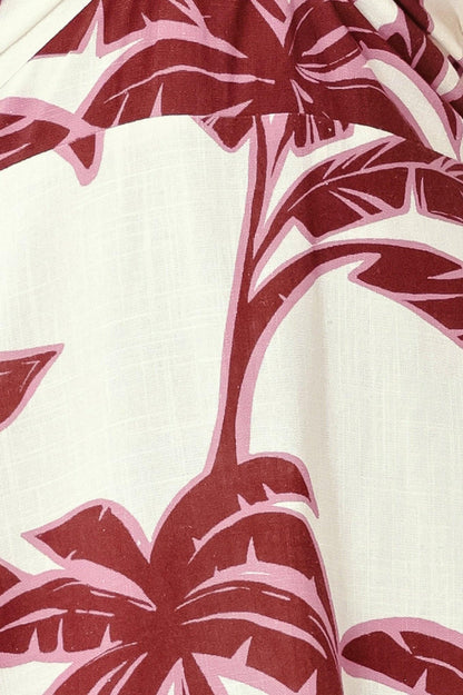 Close-up of pink palm tree pattern on a white background