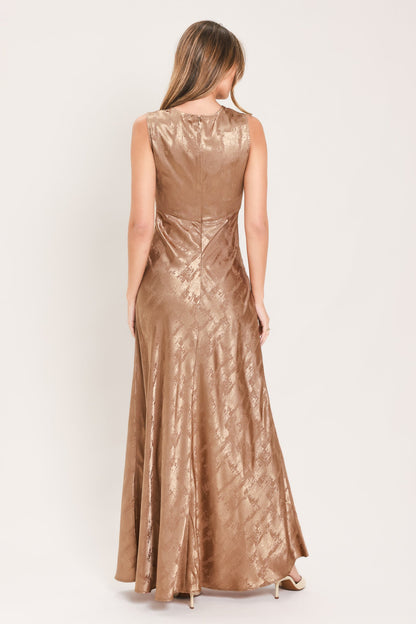 back view of sleeveless gown for evening in a champagne color subtle metallic finish and textured jacquard detailing