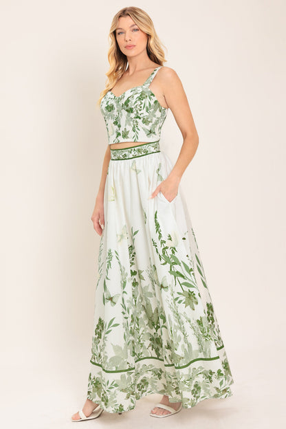Woman wearing a green and white floral dress on a white background