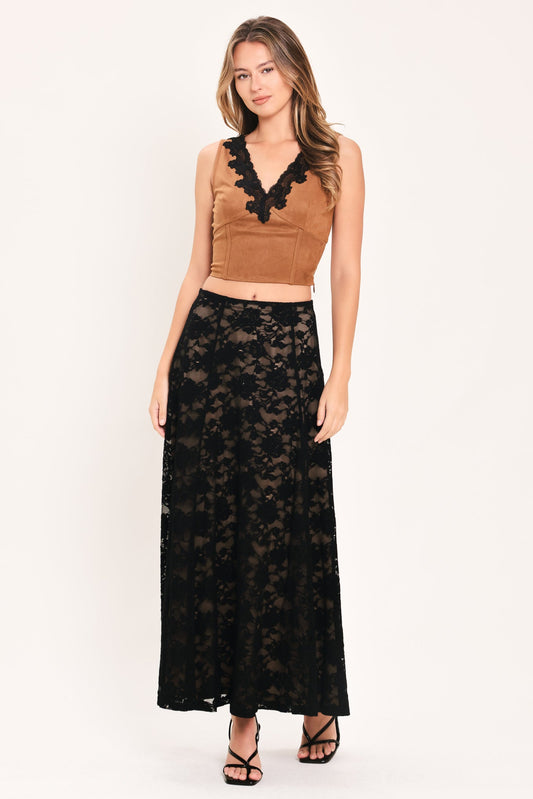 A woman modeling a two-piece outfit consisting of a brown velvet sleeveless crop top with black lace trim and a long black lace maxi skirt, against a plain white studio background.