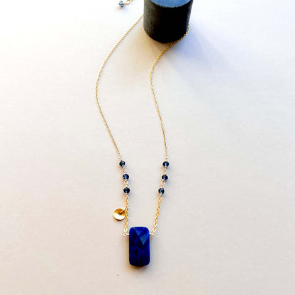 Necklace with blue pendant on a white background