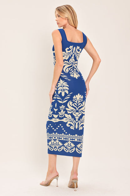 Blue sleeveless midi dress with a white damask jacquard pattern and square neckline shown from the back.