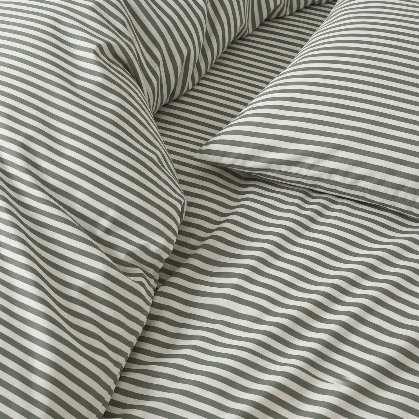 Close-up of striped fabric with green and white stripes.