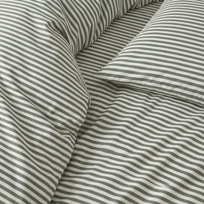 Close-up of striped fabric with green and white stripes.