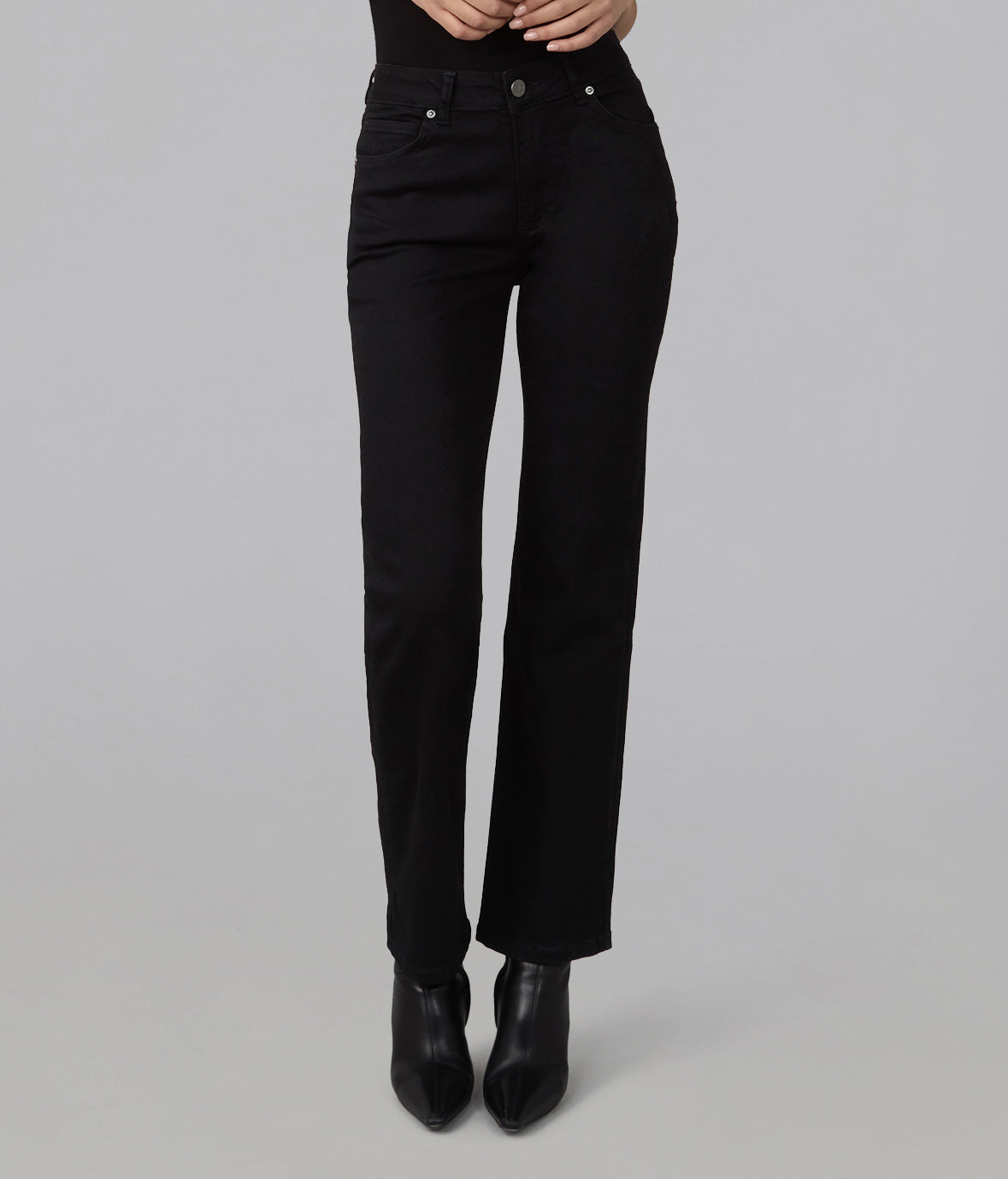 Front view of Denver black high-rise straight-leg jeans styled with black ankle boots.