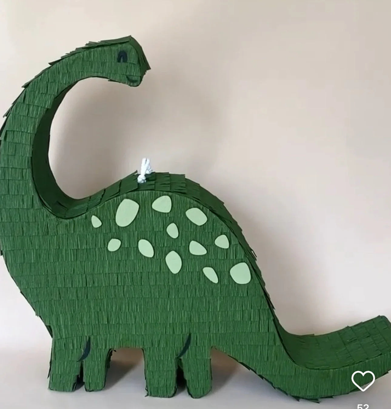 Handmade long neck dinosaur piñata in green with light green spots, designed as a candy holder for parties.