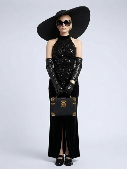 Model wearing the Madison black halter gown with a sequined bodice, draped hips, and floor-length mermaid skirt.