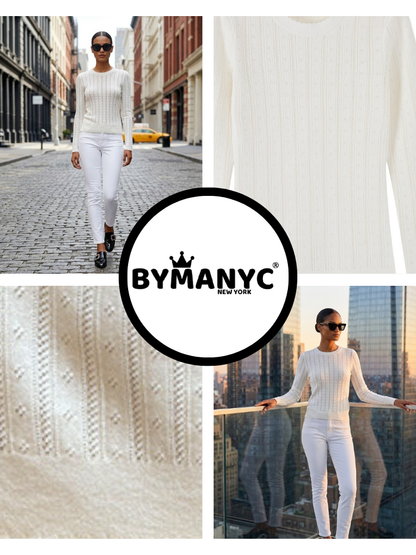 Close up of a white pointelle knit sweater.