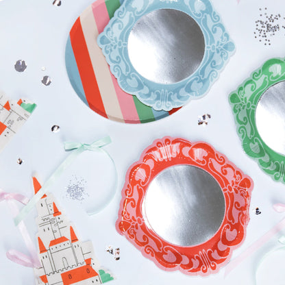 Decorative paper cutouts with colorful frames and castle design on a white background