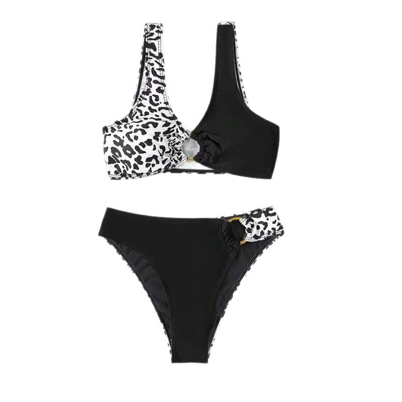 Split swimsuit featuring leopard print in contrasting colors, with a black bottom and a one-shoulder top design.