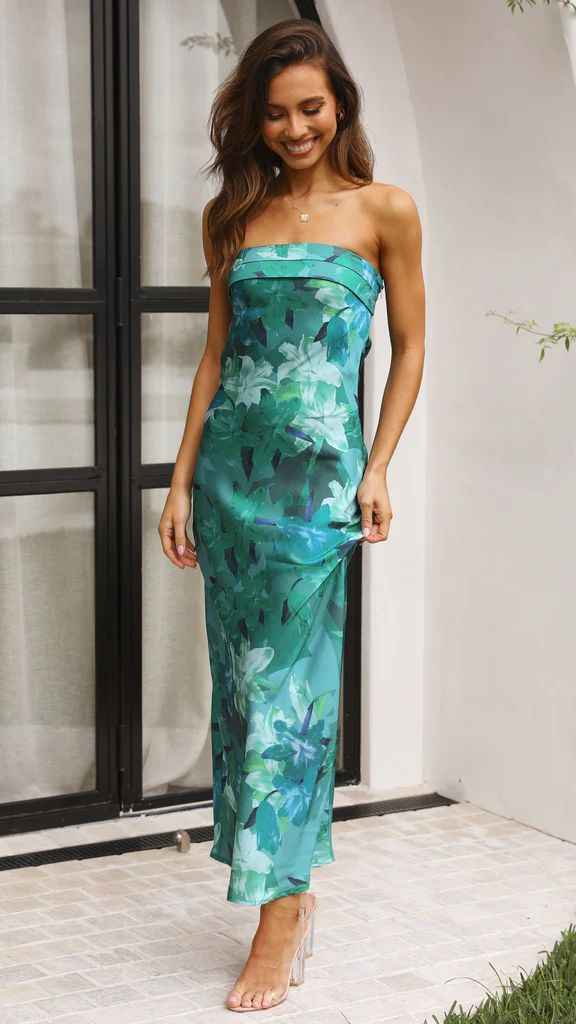 Satin strapless backless midi dress in green with floral print, featuring a side slit and a fitted silhouette.