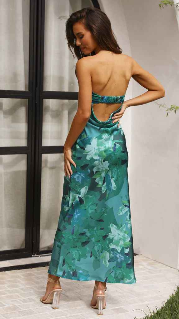 Satin strapless backless midi dress in teal with floral print, featuring a side slit and fitted silhouette.