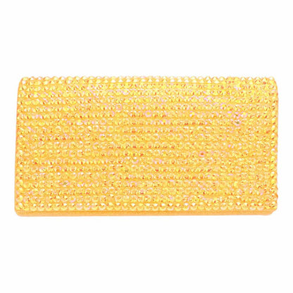 Yellow beaded clutch bag on a white background