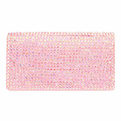 Pink clutch bag with rhinestone embellishments on a white background
