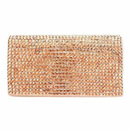Rose gold clutch bag with crystal embellishments on a white background