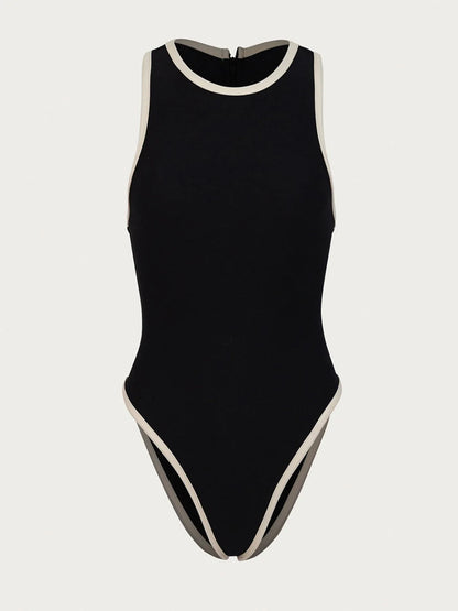 Black swimsuit with white trim on a light gray background