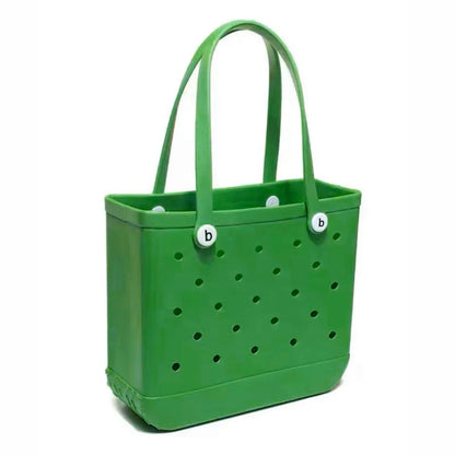 Green tote bag with perforated design and white accents on a white background