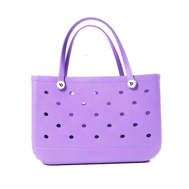 Purple perforated handbag on a white background