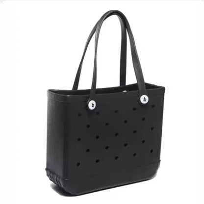 Black tote bag with perforated design and brand logo on a white background