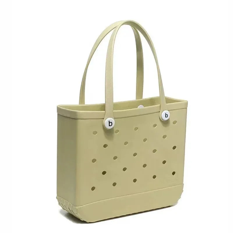 Light green tote bag with perforated design and brand logo on a white background