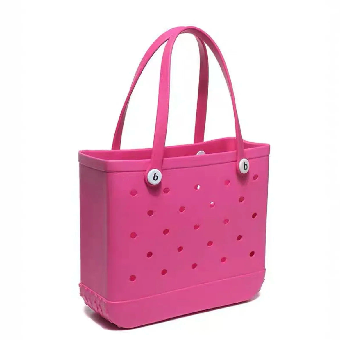 Pink tote bag with polka dot pattern on a white background