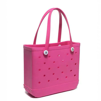 Pink tote bag with polka dot pattern on a white background