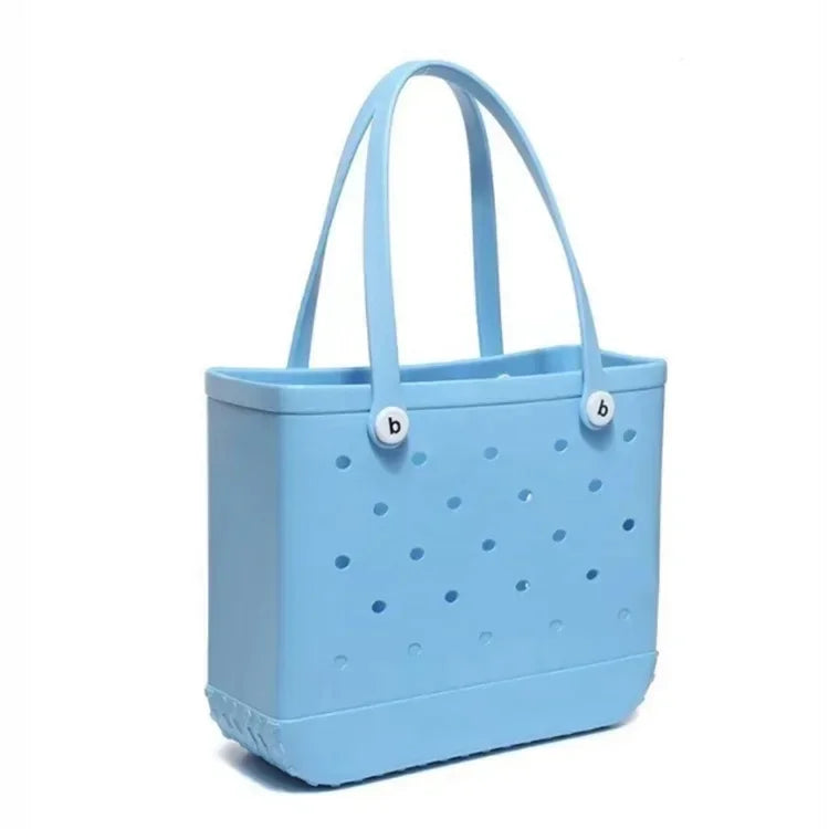 Light blue tote bag with perforated design on a white background