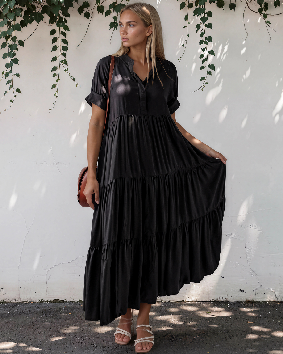 Model wearing a short sleeve tiered maxi dress