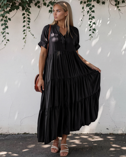 Model wearing a short sleeve tiered maxi dress