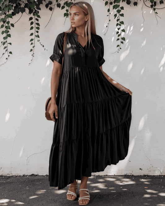Model wearing a short sleeve tiered maxi dress