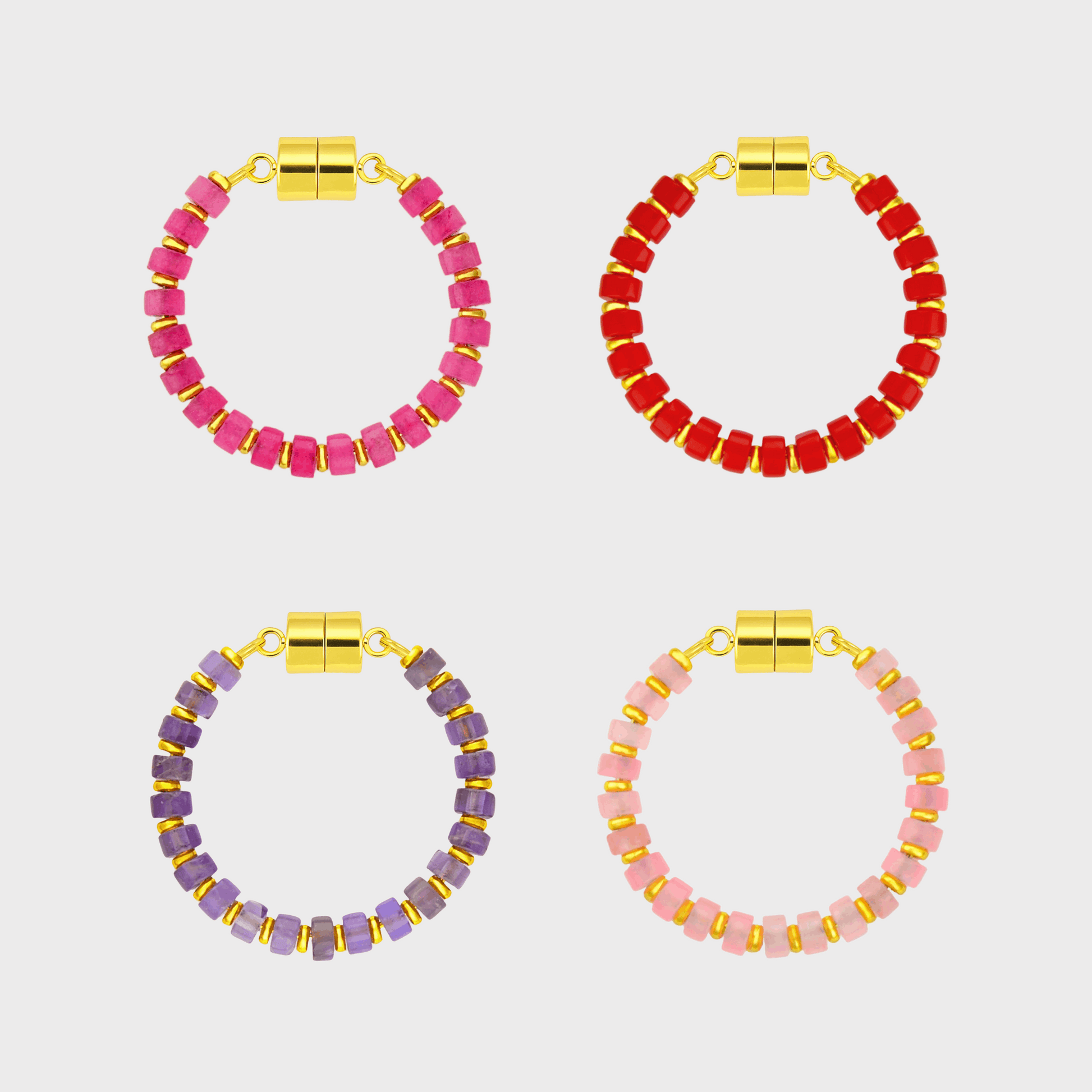 Four circular wine charms in pink, red, purple, and light pink beads with gold metal spacers and magnetic clasps.