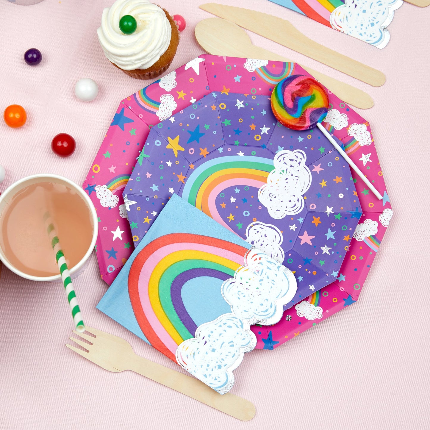 Party tablespace featuring rainbow color striped paper drinking straws