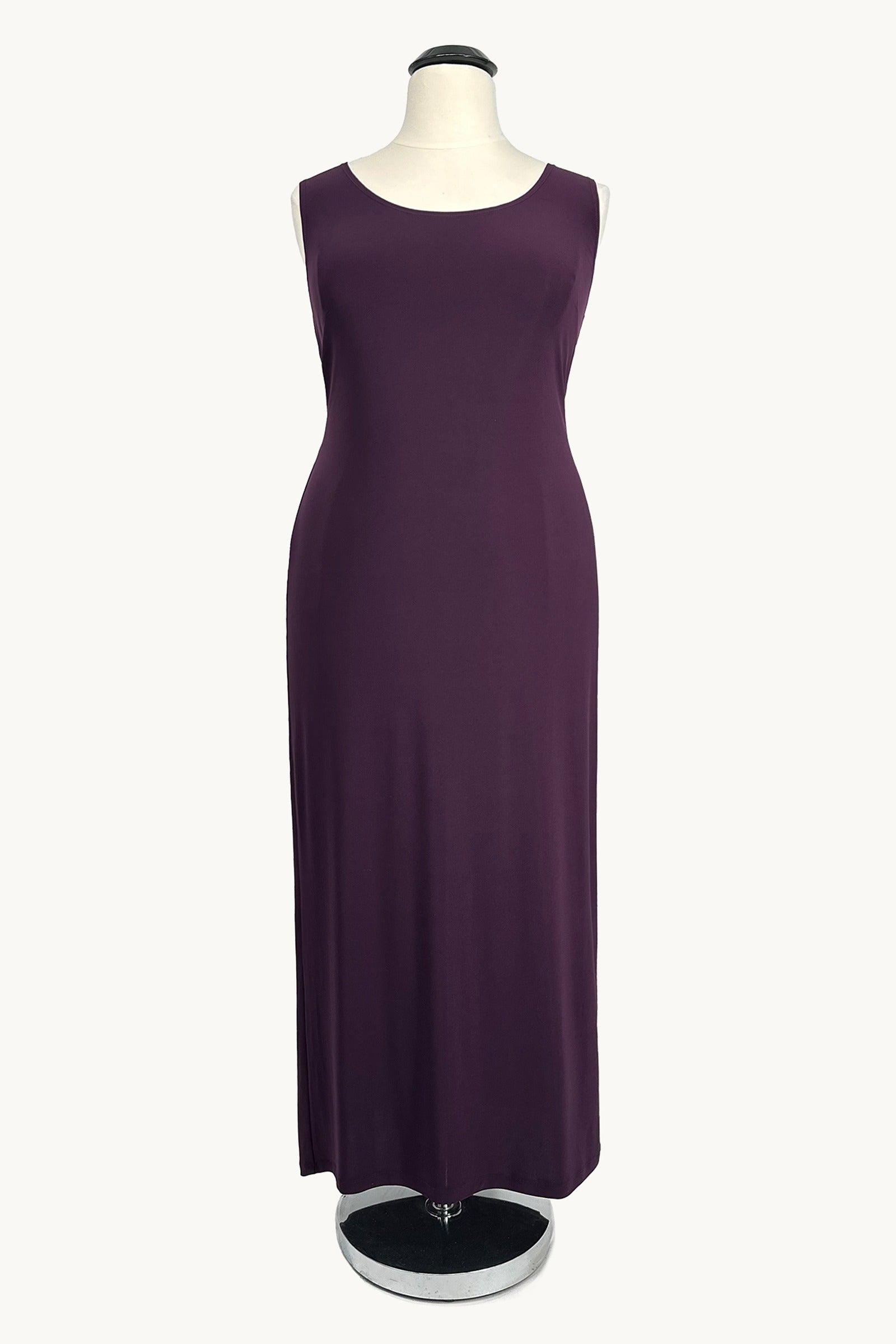 Purple dress on a mannequin against a white background