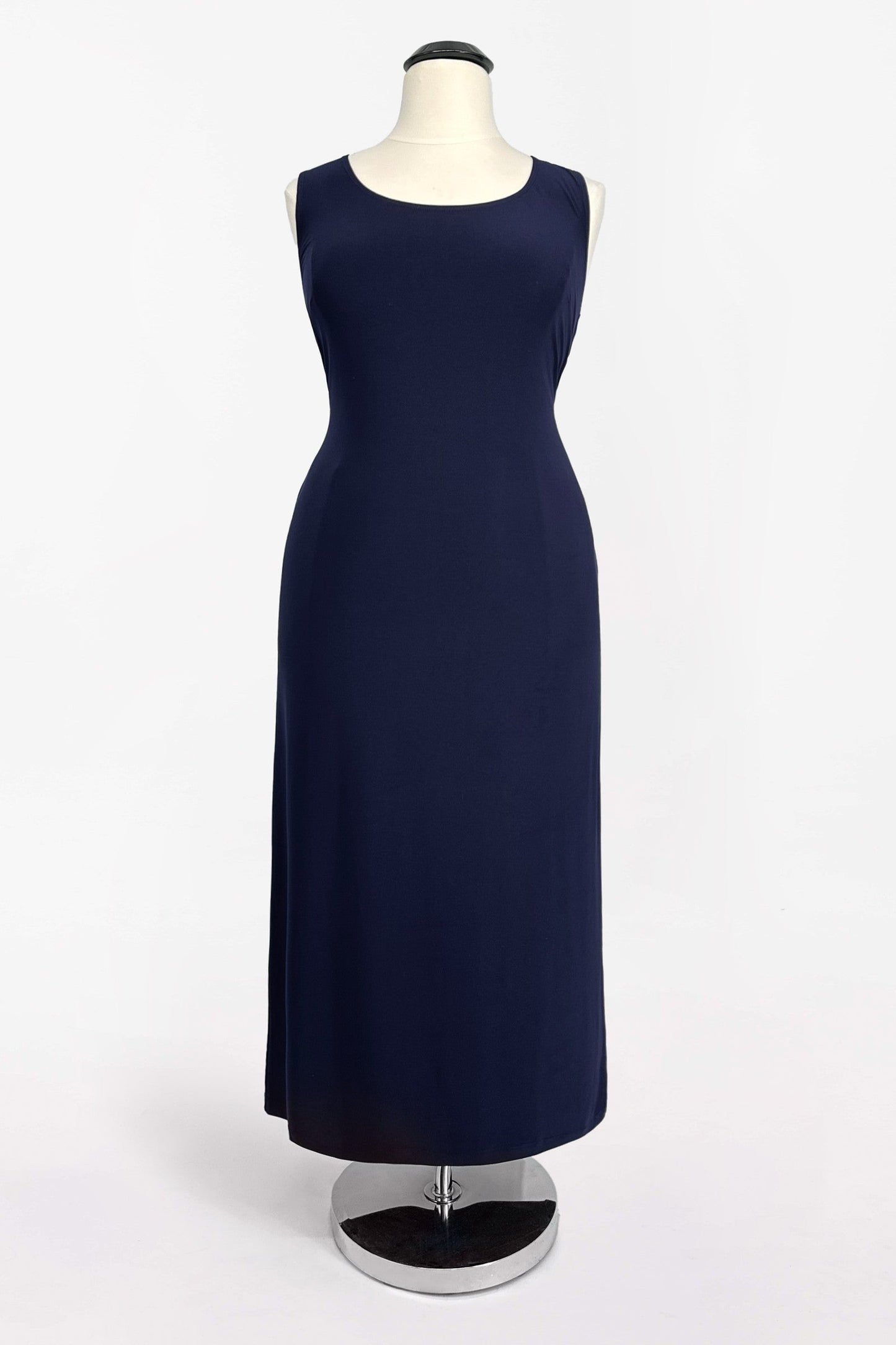 Navy blue dress on a mannequin against a white background