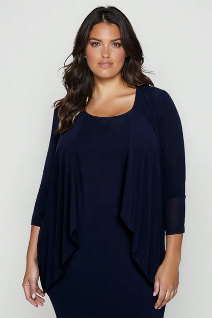 Woman wearing a navy blue dress against a white background