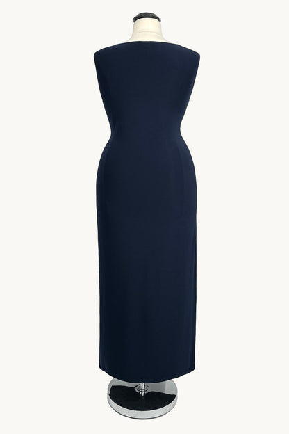 Navy blue dress on a mannequin against a white background