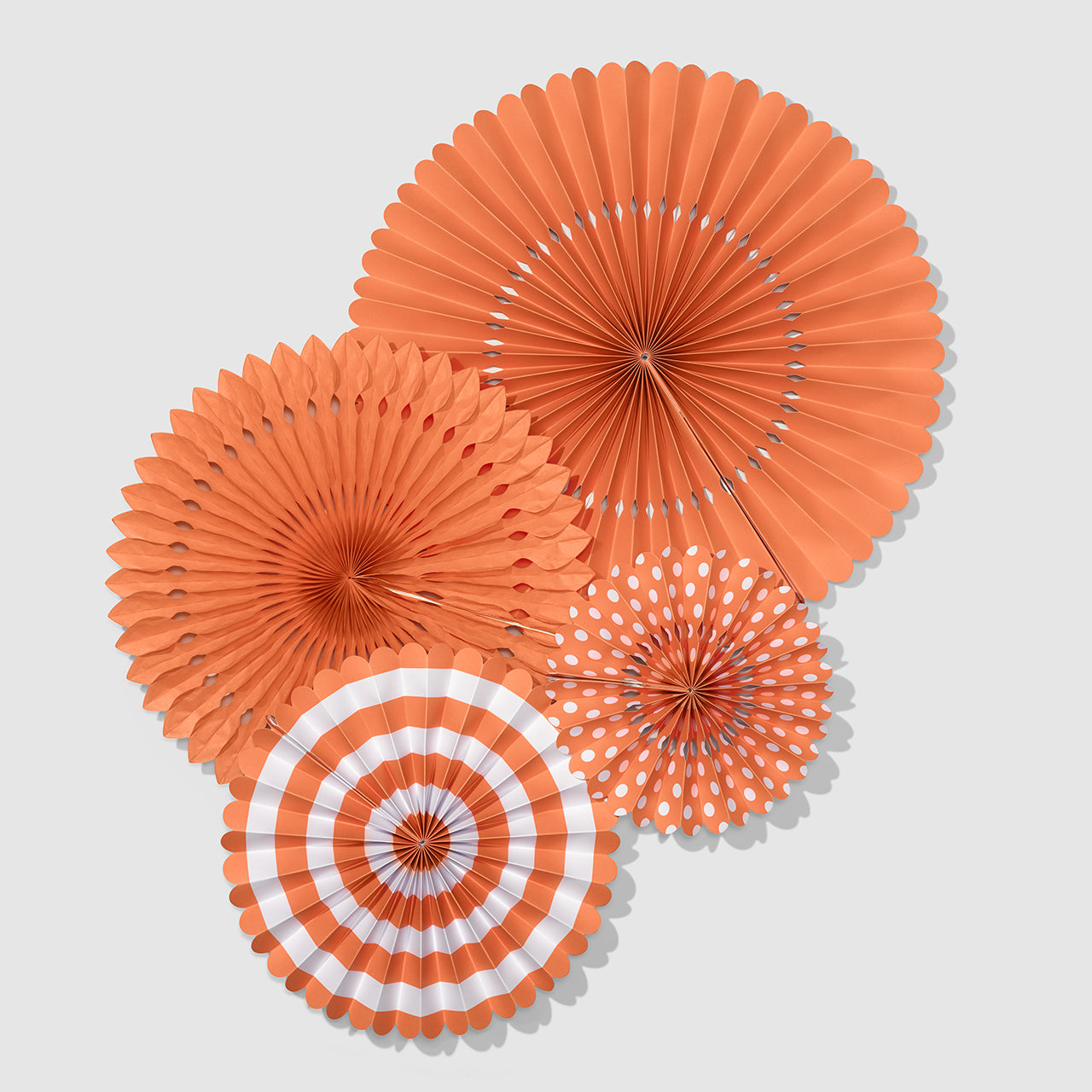 Coral orange fan party decorations.