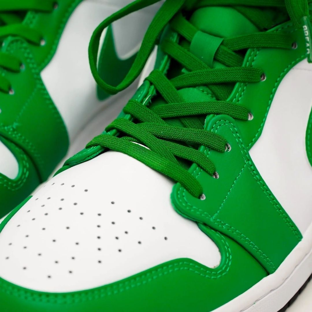 Lucky green elastic shoelaces with a smooth texture, paired with white sneaker detailing and green accents.