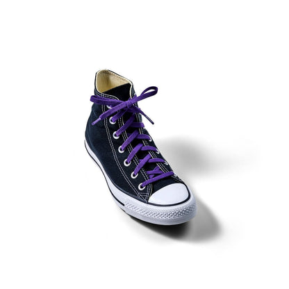 Cosmic purple elastic shoelaces threaded through a black high-top sneaker.