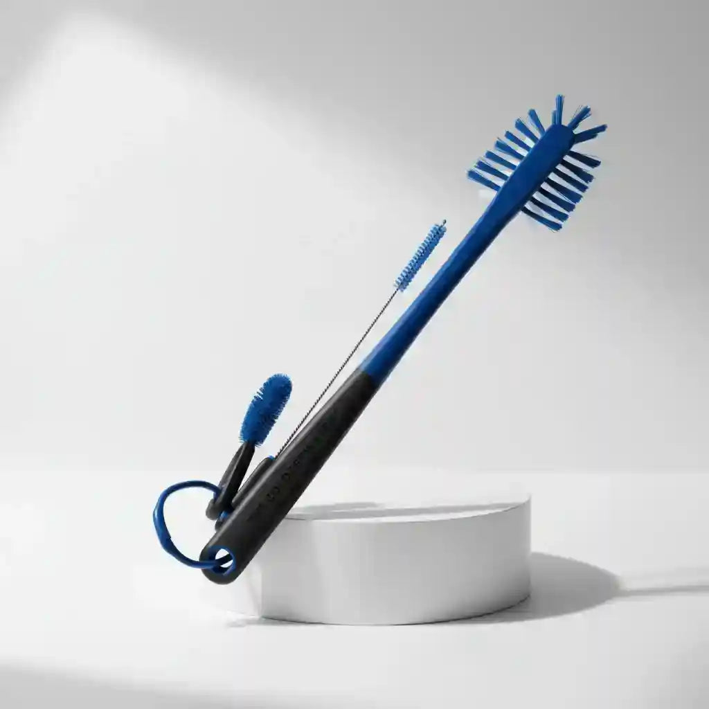 Blue and black cleaning brush with bristle head on a white background