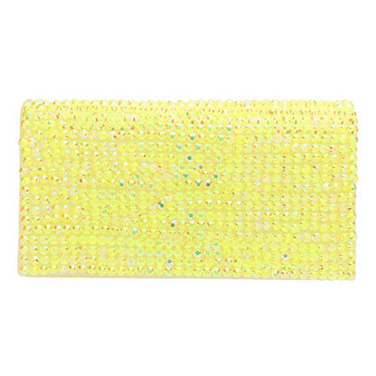 Yellow sponge with a textured surface on a white background