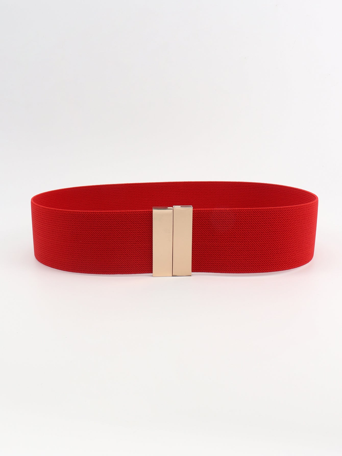 Red belt with a gold buckle on a white background