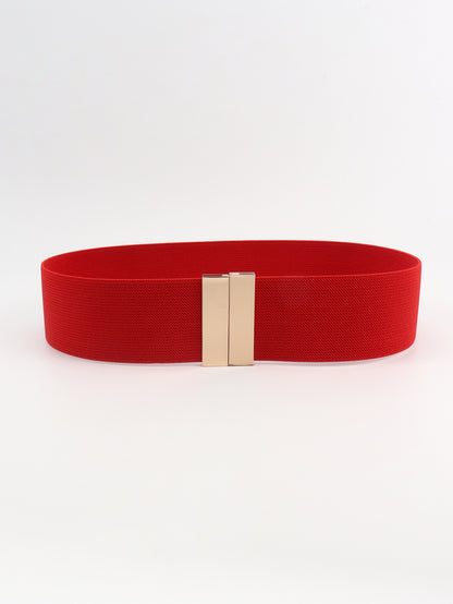 Red belt with a gold buckle on a white background