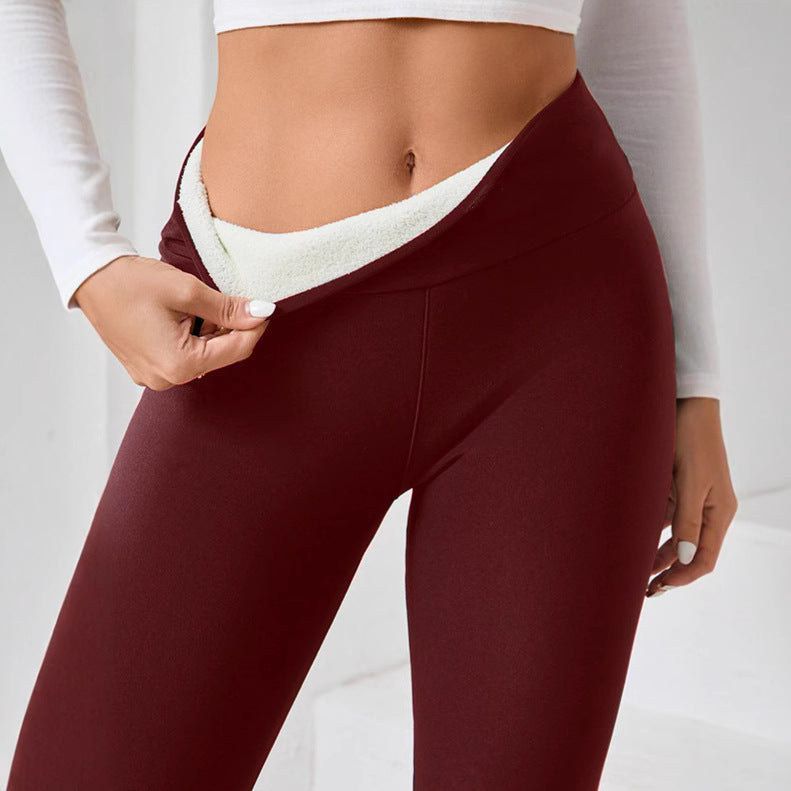 Burgundy fabric leggings with a thick white fleece lining visible at the folded waistband.