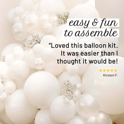 White balloon arch with text praising the balloon kit's ease of assembly.