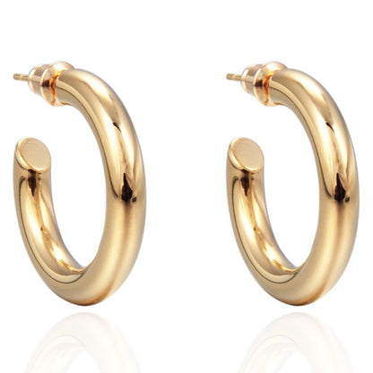 Gold hoop earrings on a white background