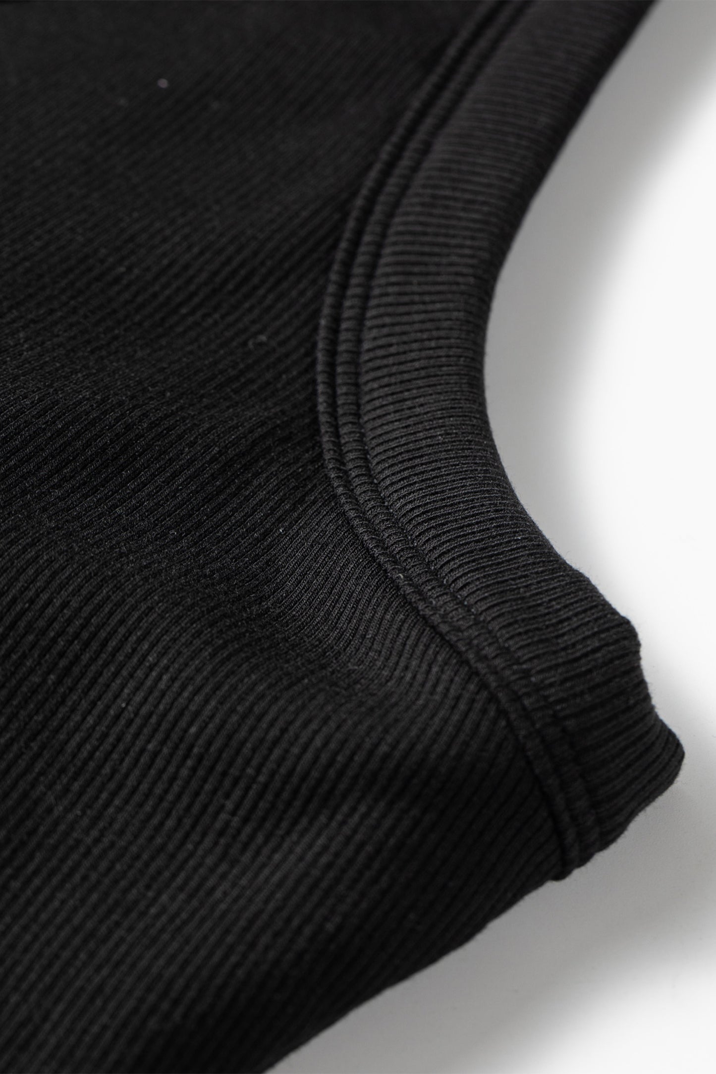 Close-up of a black sleeve on a white background